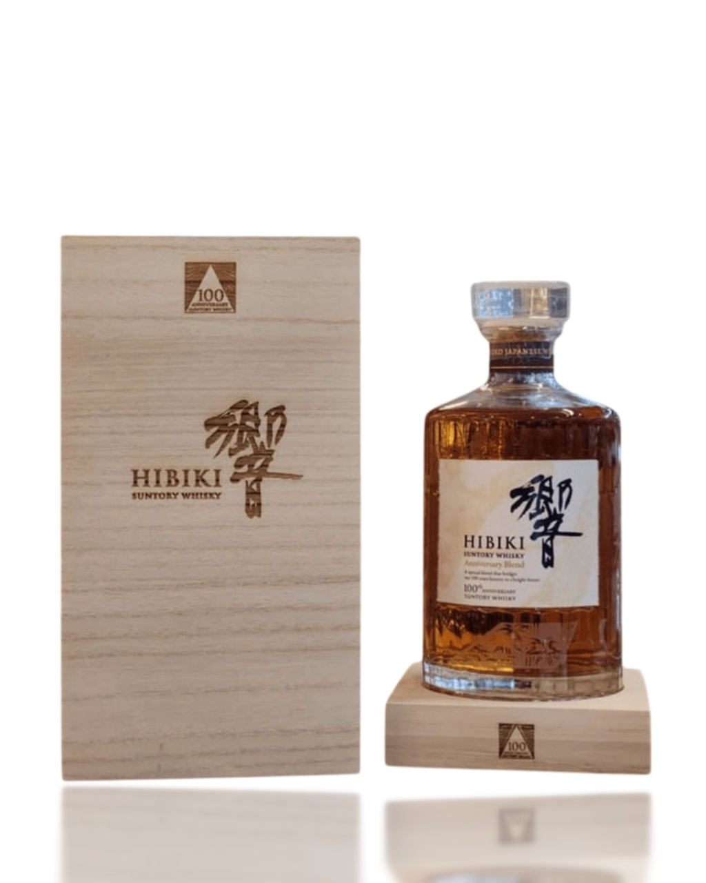 Hibiki whisky bottle and wooden box on a white background
