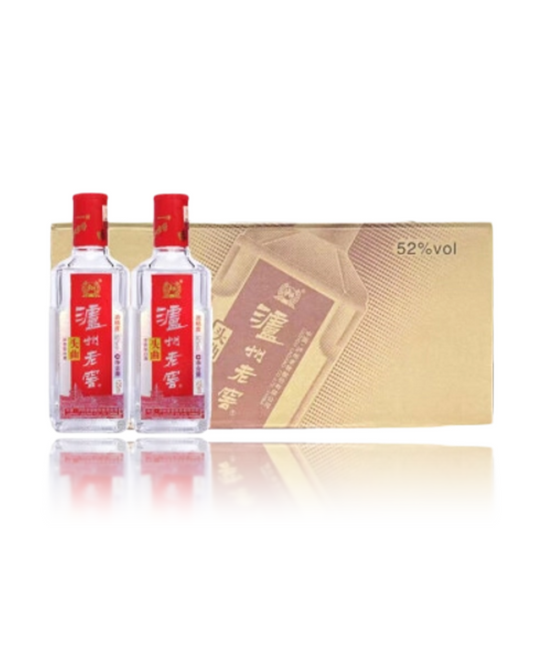 Two bottles of liquor with a gold gift box on a white background
