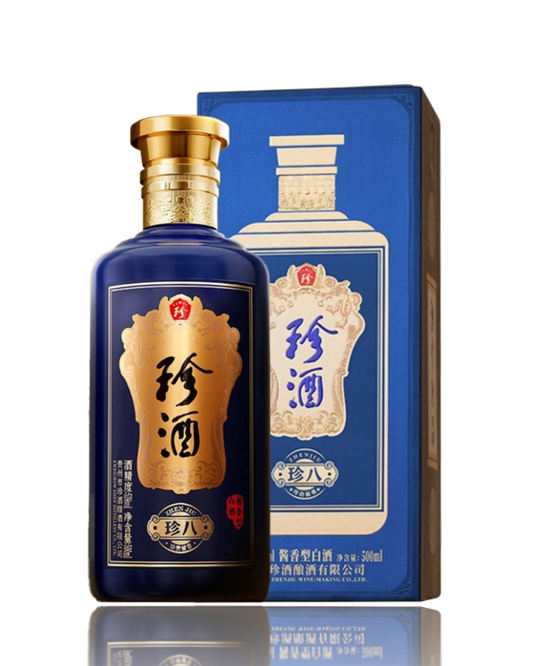 Two bottles of liquor with a gold gift box on a white background