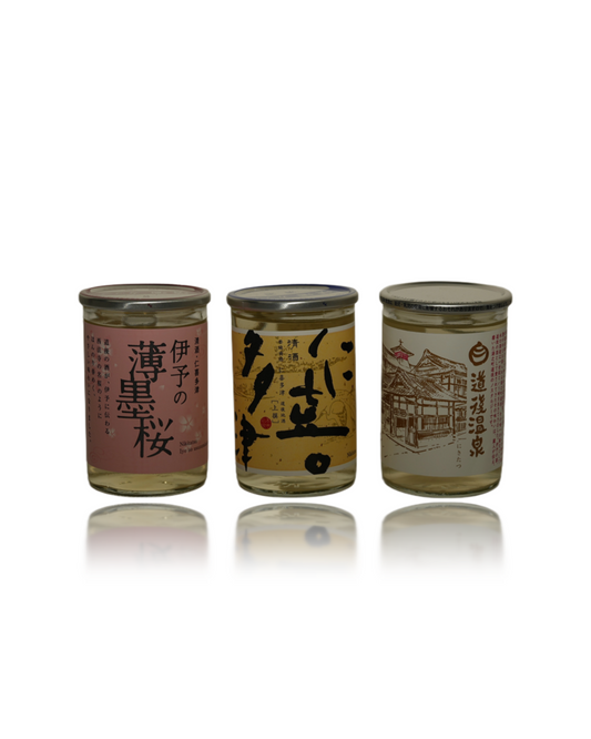 Front view of NIKITATSU Dogo 3-bottle sake tasting set featuring 180ml Junmai Ginjo, Junmai, and Honjozo bottles on a white background, premium Ehime craft sake at Love My Booze Australia.